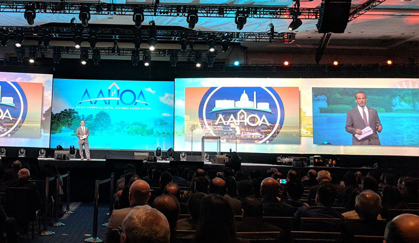 Trump Hotels CEO Eric Danziger on stage at AAHOA's annual convention.