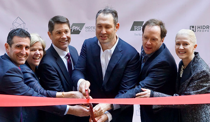Executives at the ribbon cutting for the Embassy Suites by Hilton New York Midtown Manhattan.