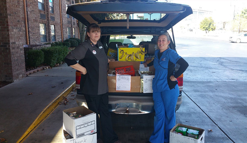 Myer Hotels volunteers participate in a food drive.
