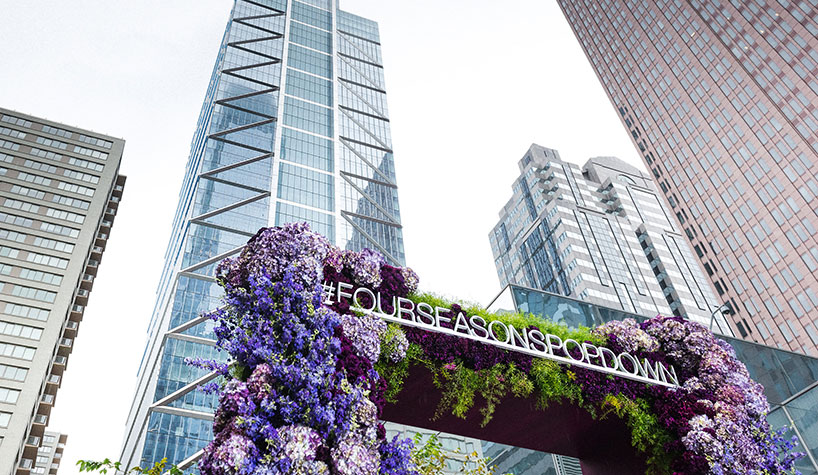 The Four Seasons Hotel Philadelphia at Comcast Center is in view above a Jeff Leatham-designed floral installation.