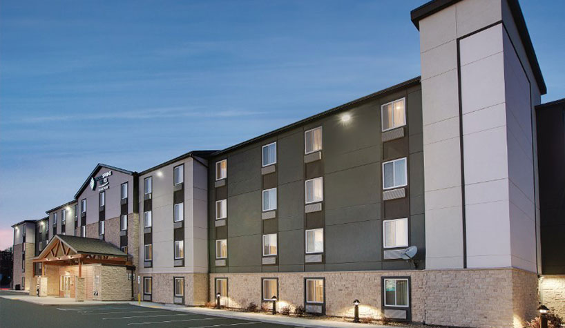 Choice Hotels grows Western presence with 14 new WoodSpring Suites.