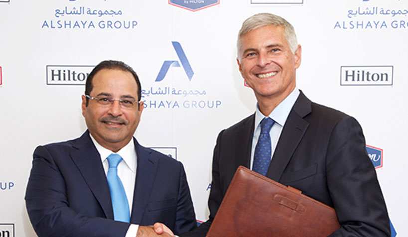 Mohammed Alshaya, executive chairman of Alshaya Group, left, and Chris Nassetta, president/CEO of Hilton, right, at the signing ceremony in London.