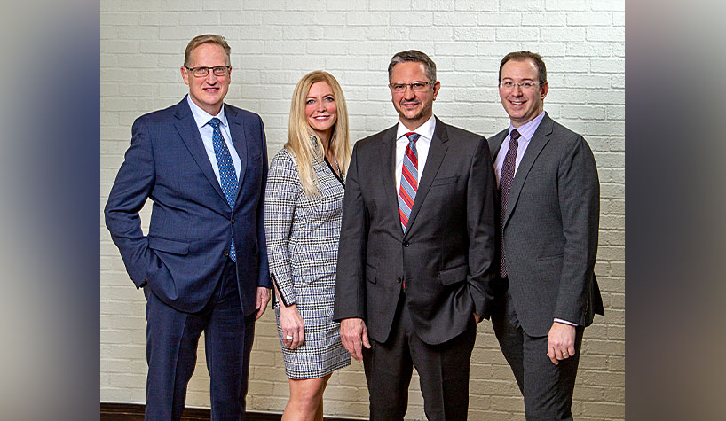 The leadership team of the newly launched Boutique Hotel Professionals (left to right): Jim Fowler, VP of operations; Jenifer Neptune, chief investment officer; Paul Wegert, CEO; and Eric Djordjevic, VP of food and beverage.