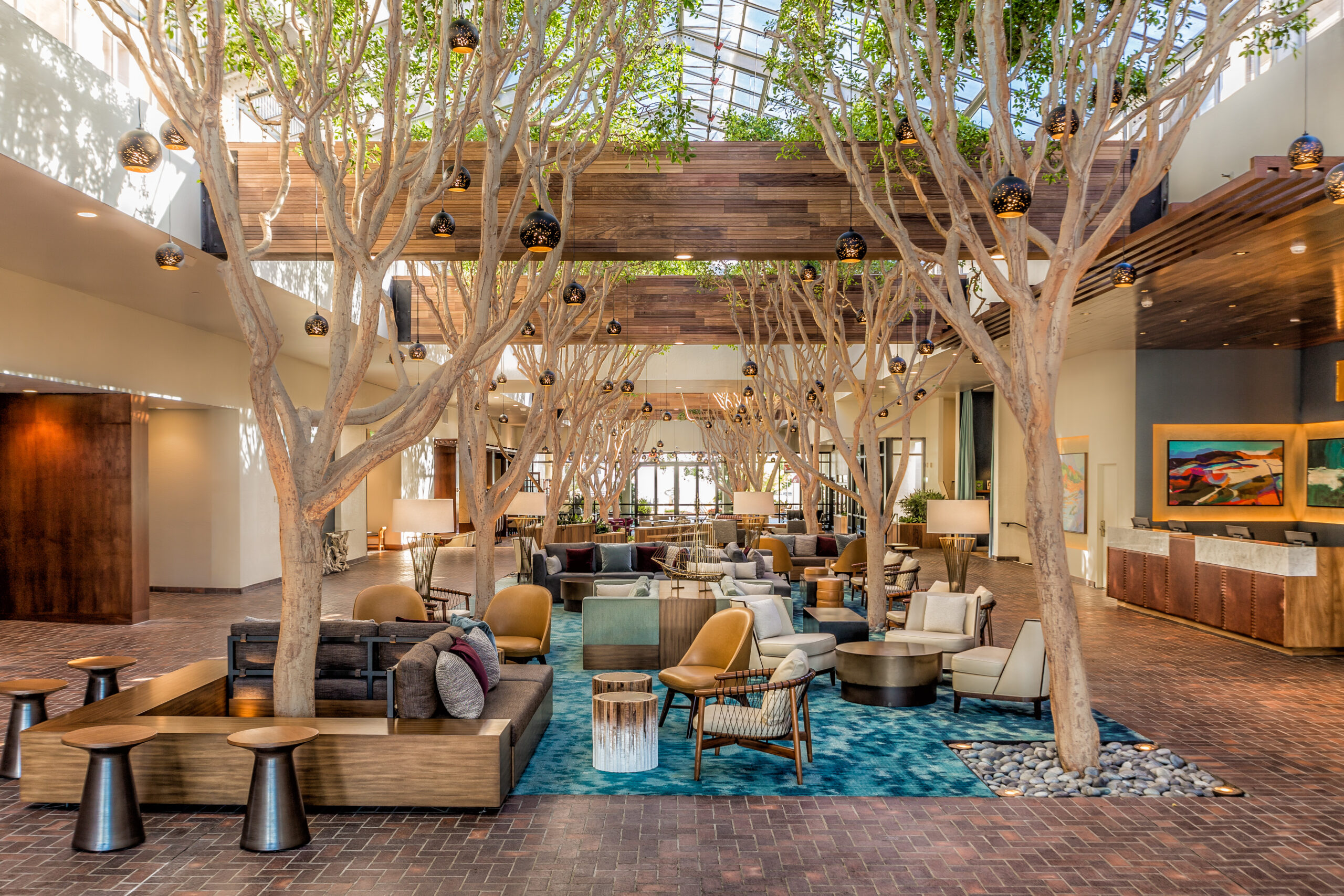 A canopy of trees inside the Portola Hotel & Spa at Monterey Bay.