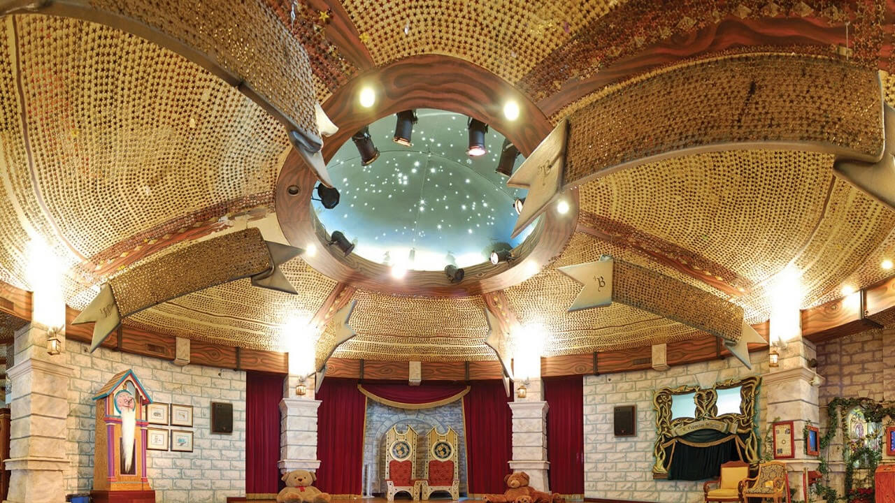 The Castle of Miracles, where the ceiling sparkles with golden stars—each representing a child who has stayed at the village.